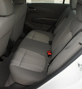chevrolet sonic 2012 white sedan gasoline 4 cylinders front wheel drive 6 spd auto connivity plus cruise pk 77090