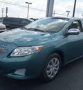 toyota corolla 2010 dk  green sedan le gasoline 4 cylinders front wheel drive automatic 37087