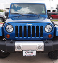 jeep wrangler unlimited 2009 blue suv sahara gasoline 6 cylinders 4 wheel drive automatic with overdrive 76018