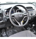 honda fit 2010 black hatchback base gasoline 4 cylinders front wheel drive 5 speed manual 78233