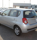 chevrolet aveo 2011 silver hatchback lt gasoline 4 cylinders front wheel drive automatic 76087