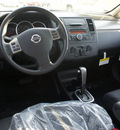 nissan versa 2012 red hatchback 1 8 sl gasoline 4 cylinders front wheel drive cont  variable trans  75150