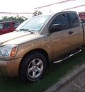 nissan titan 2004 brown le gasoline 8 cylinders rear wheel drive automatic 77301