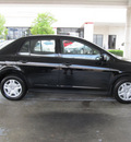 nissan versa 2011 black sedan 1 8 s gasoline 4 cylinders front wheel drive automatic with overdrive 77477