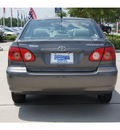 toyota corolla 2005 brown sedan gasoline 4 cylinders front wheel drive automatic 77090