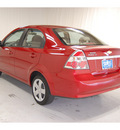 chevrolet aveo 2011 red sedan lt gasoline 4 cylinders front wheel drive automatic with overdrive 77630
