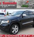jeep grand cherokee 2012 black suv overland gasoline 8 cylinders 2 wheel drive 6 speed automatic 77450
