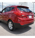 hyundai tucson 2010 dk  red suv gasoline 4 cylinders front wheel drive automatic 78006