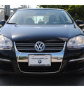 volkswagen jetta 2010 black hatchback limited edition gasoline 5 cylinders front wheel drive automatic 77002