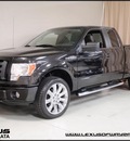 ford f 150 2010 black stx gasoline 8 cylinders 4 wheel drive automatic with overdrive 55391