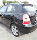 hyundai accent 2009 black hatchback se gasoline 4 cylinders front wheel drive 5 speed manual 13502