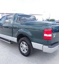 ford f 150 2007 dk  green pickup truck xlt gasoline 8 cylinders rear wheel drive automatic 77388