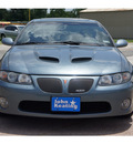 pontiac gto 2006 gray coupe gasoline 8 cylinders rear wheel drive automatic with overdrive 77037