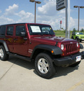 jeep wrangler unlimited 2012 red suv sport gasoline 6 cylinders 4 wheel drive automatic 75110