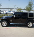 jeep wrangler unlimited 2009 black suv sahara gasoline 6 cylinders 2 wheel drive automatic with overdrive 76137