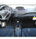 honda fit 2012 black hatchback sport gasoline 4 cylinders front wheel drive 5 speed manual 77025
