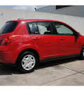 nissan versa 2012 red hatchback 1 8 s gasoline 4 cylinders front wheel drive automatic 77477