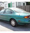 ford taurus 1997 green sedan gl gasoline v6 front wheel drive automatic 77070