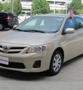 toyota corolla 2011 tan sedan le gasoline 4 cylinders front wheel drive automatic with overdrive 77090