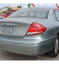 ford taurus 2005 lt  green sedan sel gasoline 6 cylinders front wheel drive automatic with overdrive 77020