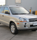 hyundai tucson 2009 silver suv gls gasoline 4 cylinders front wheel drive shiftable automatic 77074