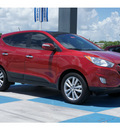 hyundai tucson 2012 dk  red limited gasoline 4 cylinders front wheel drive automatic 77094