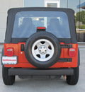 jeep wrangler 2006 orange suv se gasoline 4 cylinders 4 wheel drive 6 speed manual 77471