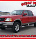 ford f 150 2003 red lariat gasoline 8 cylinders sohc 4 wheel drive automatic 79110