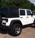 jeep wrangler unlimited 2010 white suv sport gasoline 6 cylinders 4 wheel drive automatic 77515