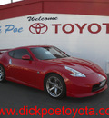 nissan 370z 2011 red coupe gasoline 6 cylinders rear wheel drive standard 79925