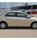 toyota corolla 2011 tan sedan le gasoline 4 cylinders front wheel drive automatic with overdrive 77469