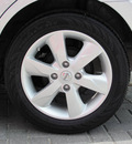 nissan versa 2011 silver hatchback sl gasoline 4 cylinders front wheel drive automatic 33884