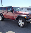 jeep wrangler unlimited 2009 red suv x gasoline 6 cylinders 4 wheel drive automatic 99352