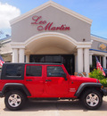 jeep wrangler unlimited 2010 red suv sport gasoline 6 cylinders 4 wheel drive automatic 77566