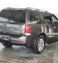 nissan armada 2011 dk  gray suv platinum gasoline 8 cylinders 2 wheel drive automatic with overdrive 77477