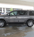 nissan armada 2011 dk  gray suv platinum gasoline 8 cylinders 2 wheel drive automatic with overdrive 77477