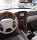 jeep grand cherokee 2006 black suv overland gasoline 8 cylinders 4 wheel drive automatic 33021