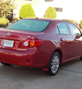toyota corolla 2009 red sedan le gasoline 4 cylinders front wheel drive automatic with overdrive 77074