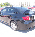 subaru impreza wrx 2011 black sedan sti gasoline 4 cylinders all whee drive 6 speed manual 77074