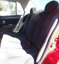 nissan versa 2010 red sedan gasoline 4 cylinders front wheel drive 6 speed manual 13502