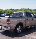 ford f 150 2005 beige lariat 8 cylinders automatic 77074