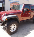 jeep wrangler unlimited 2010 red suv sport gasoline 6 cylinders 4 wheel drive automatic 76520