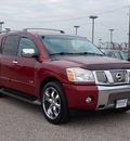 nissan armada 2005 dk  red suv le 8 cylinders automatic with overdrive 77074