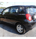 chevrolet aveo5 2009 black hatchback lt gasoline 4 cylinders front wheel drive automatic with overdrive 77581