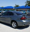 pontiac grand am 2004 gray sedan se1 gasoline 6 cylinders front wheel drive 4 speed automatic 76206