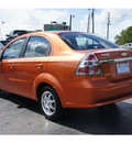 chevrolet aveo 2007 orange sedan lt 4 cylinders automatic 77074