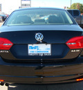 volkswagen jetta 2011 black sedan 5 cylinders automatic 79936