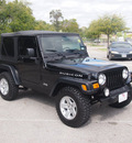 jeep wrangler 2004 black suv rubicon gasoline 6 cylinders 4 wheel drive 5 speed manual 76049