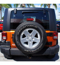 jeep wrangler 2010 orange suv sport gasoline 6 cylinders 4 wheel drive 6 speed manual 33157
