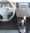 nissan versa 2012 white hatchback sl gasoline 4 cylinders front wheel drive cont  variable trans  33884